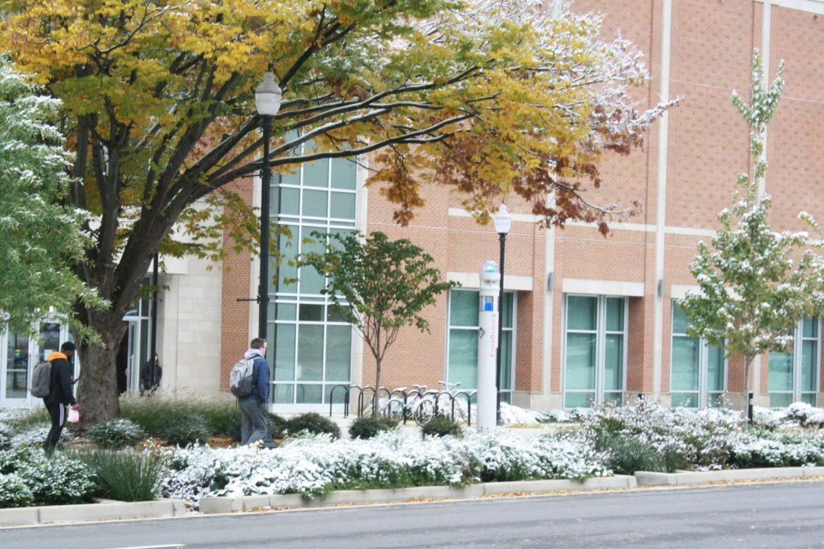 Students walk across a snow covered UT campus on Tuesday, November 12, 2019.