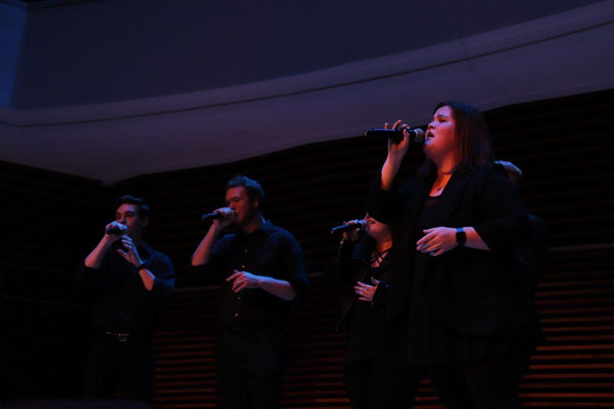 Hannah Maner pours her heart out into the microphone in her part of the UT Singers' performance of "Alone" by Billy Steinberg.