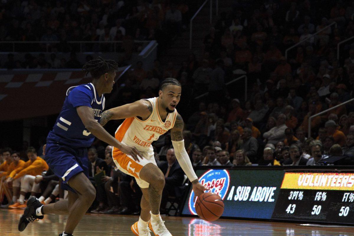Tennessee player, Lamonte Turner, #1, breaks away from a defender in the game against UNC Asheville at Thompson Boiling Arena on Tuesday, November 5, 2019.