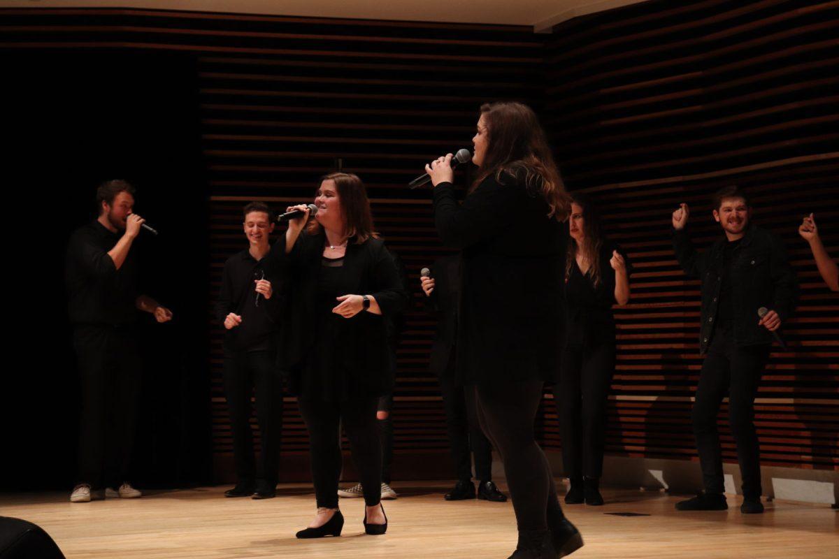 Hannah Maner (left) joins Ellie Smith (right) center stage to complete Eric Carmen's "Make Me Lose Control," during the Homecoming Concert on Friday, November 1, 2019.
 