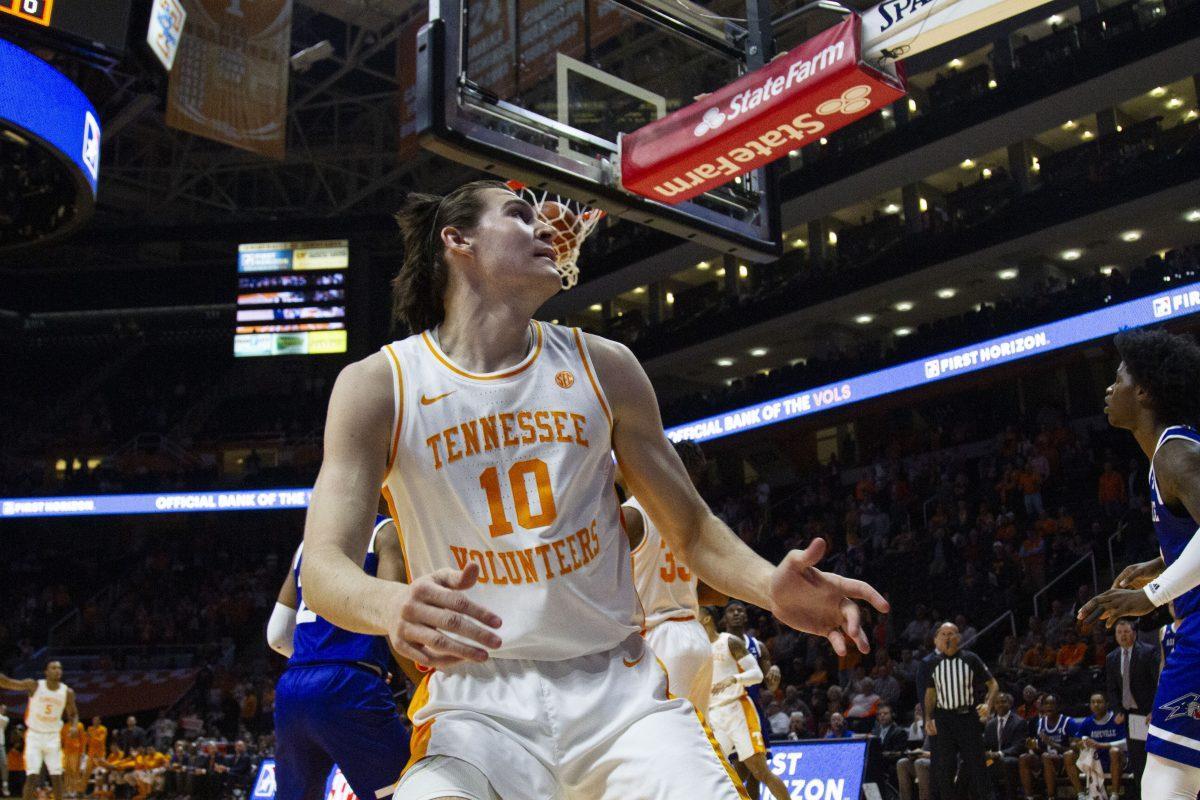 John Fulkerson, #10, braces himself after dunking a ball in the game against UNC Asheville at Thompson-Boling Arena on Tuesday, November 5, 2019. 