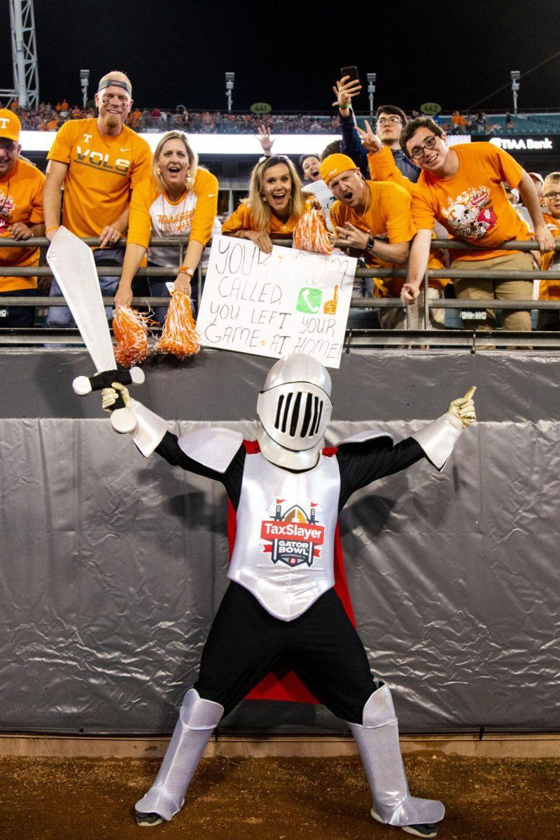 Tax Slayer mascot and Tennessee fans cheer on the Volunteers at the Tax Slayer Bowl on Thursday, January 2, 2020.