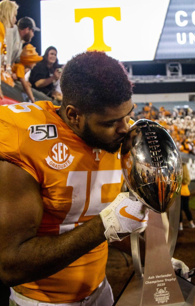 #15 Jauan Jennings showing off the trophy after the victory at the 2020 Tax Slayer Bowl game.