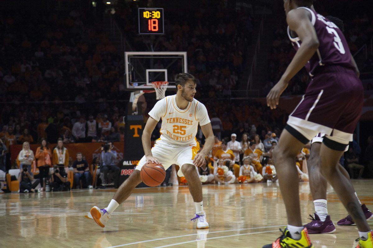 Santiago Vescovi, #25, dribbles to bring the ball towards the basket during the game against Texas A&amp;M on Tuesday, January 28, 2020 at Thompson-Boling Arena.