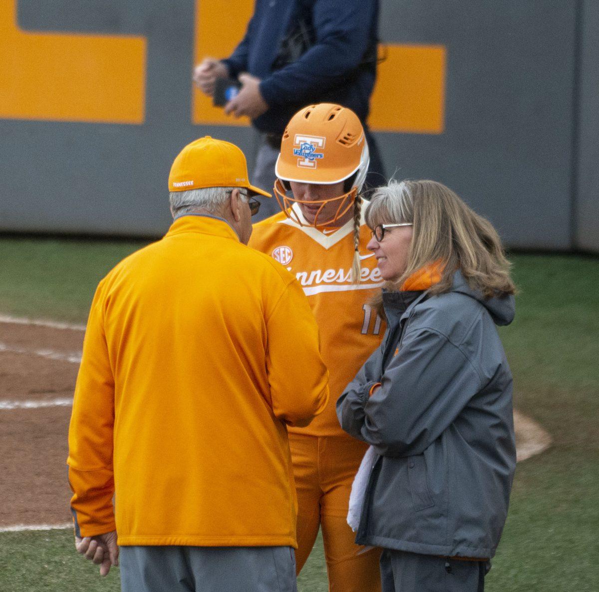 Tennessee softball Co-head Coaches Ralph and Karen Weekly with Haley Bearden, #11, during game against Kansas on Feb. 22, 2019 at Sherri Parker Lee Stadium.