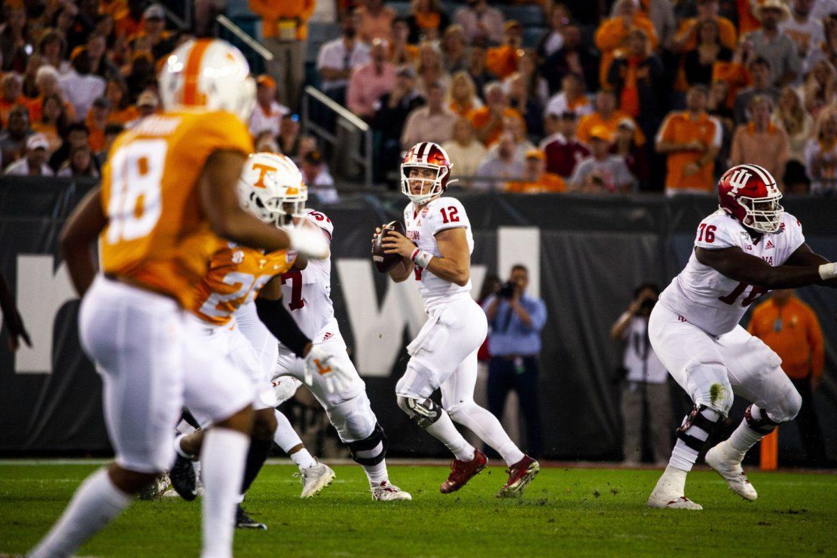 #12 Peyton Ramsey for Indian looking downfield for an open receiver at the 2020 Tax Slayer Bowl.