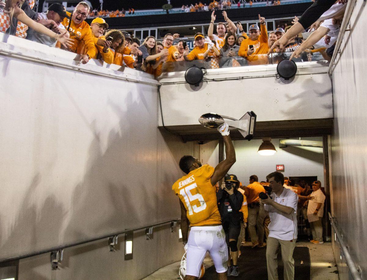 #15 Jauan Jennings showing off the trophy after the victory at the 2020 Tax Slayer Bowl game.