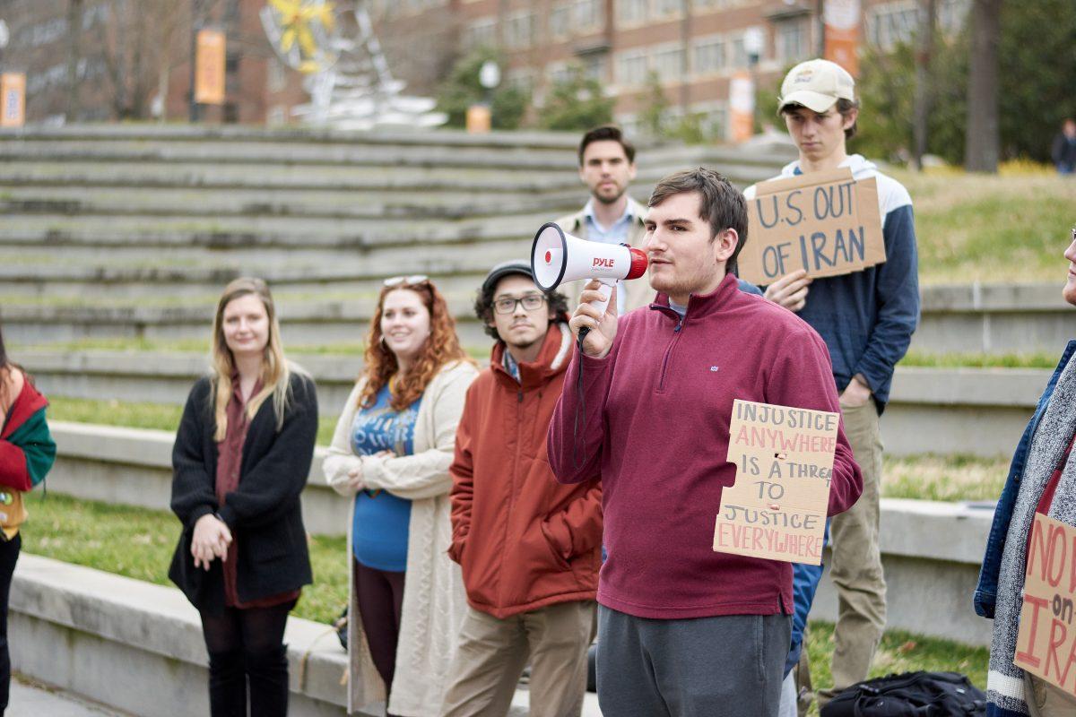Ethan Slibher voices his reasons for protesting against a possible Iran war, in the HSS amphitheater on Thursday, January 9th, 2020.