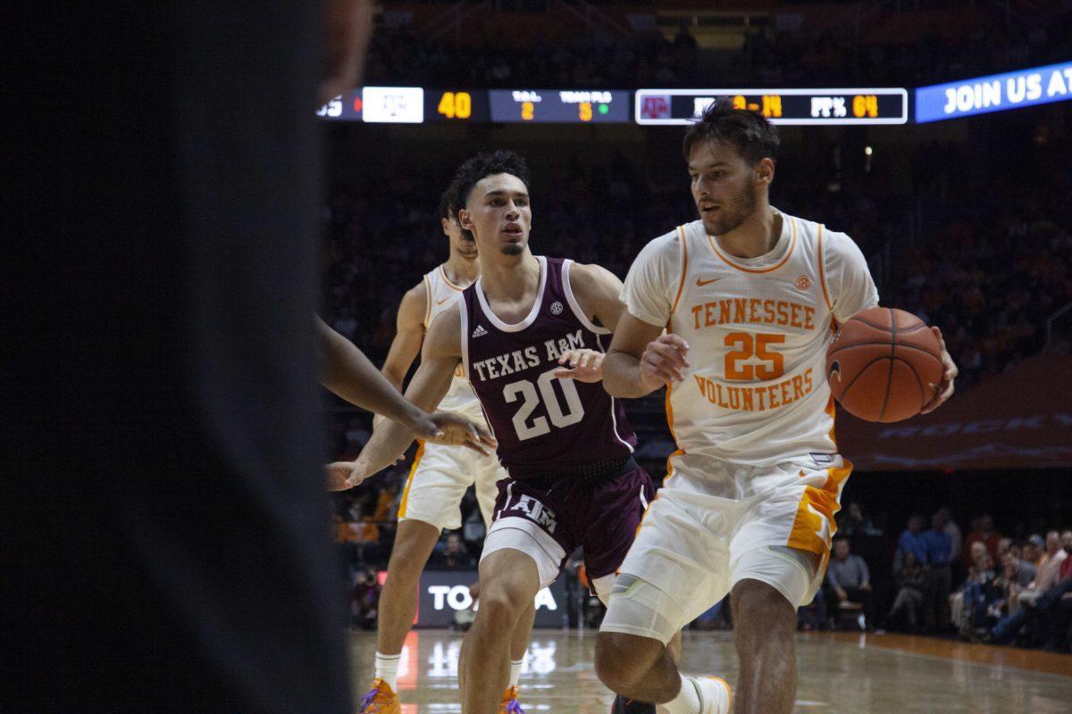 Santiago Vescovi, #25, dribbles the ball in towards the basket during the game against Texas A&amp;M on Tuesday, January 28, 2020 at Thompson-Boling Arena.