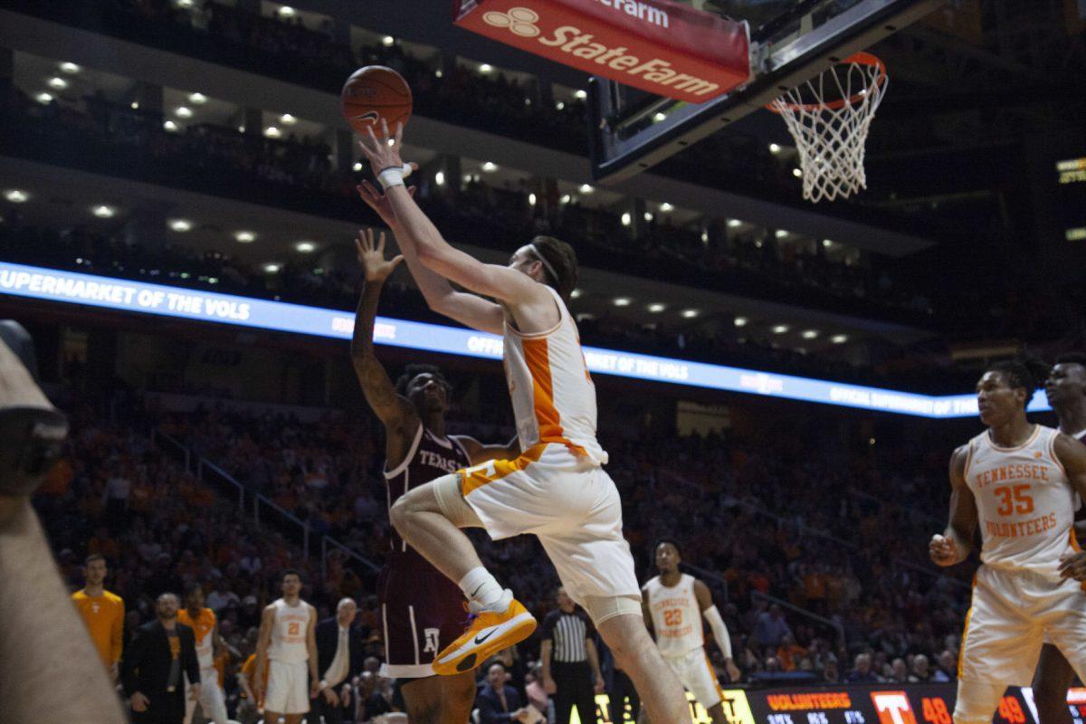 John Fulkerson, #10, reaches to try and keep the ball in bounds during the game against Texas A&amp;M on Tuesday, January 28, 2020 at Thompson-Boling Arena.