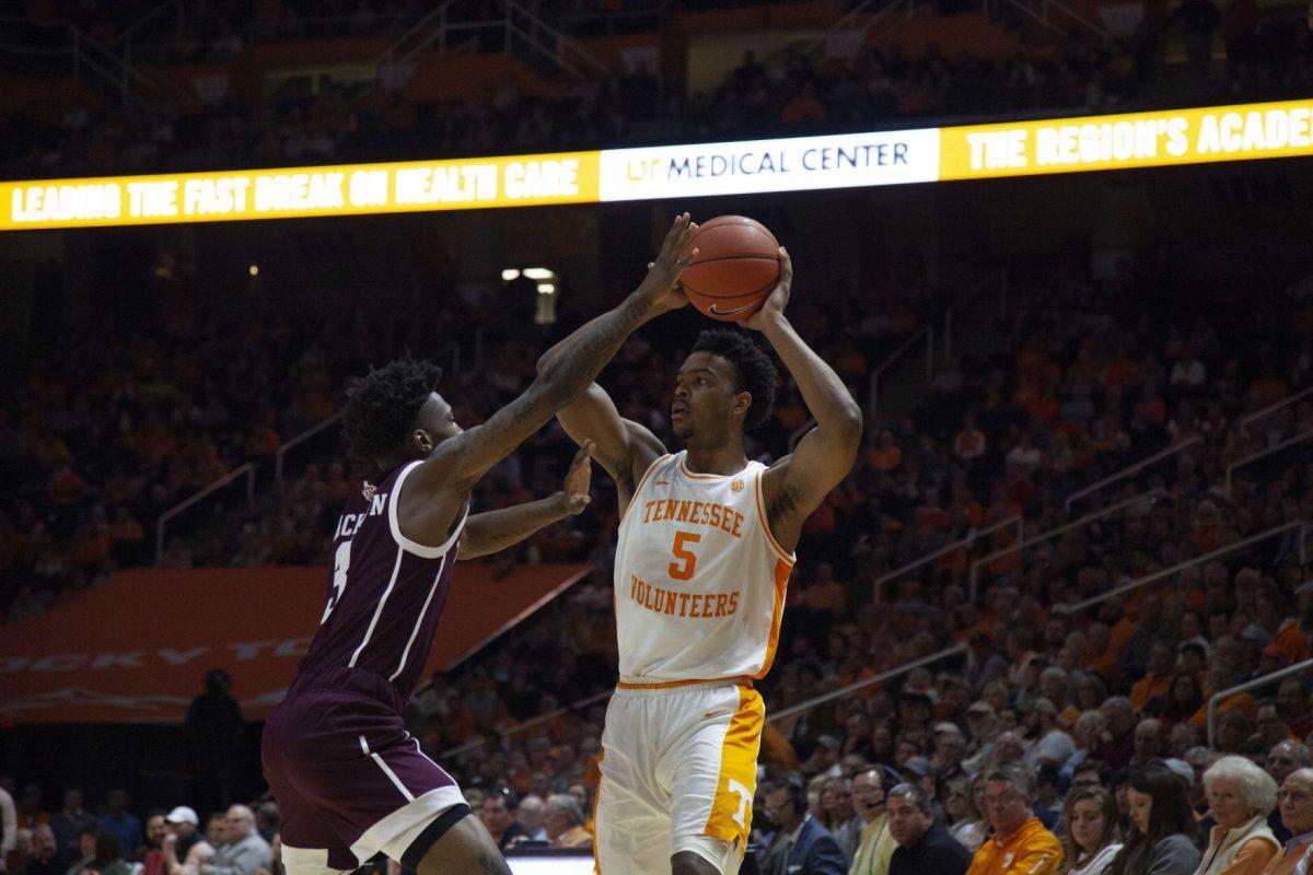 Josiah-Jordan James, #5, keeps the ball out of reach during the game against Texas A&amp;M on Tuesday, January 28, 2020 at Thompson-Boling Arena.