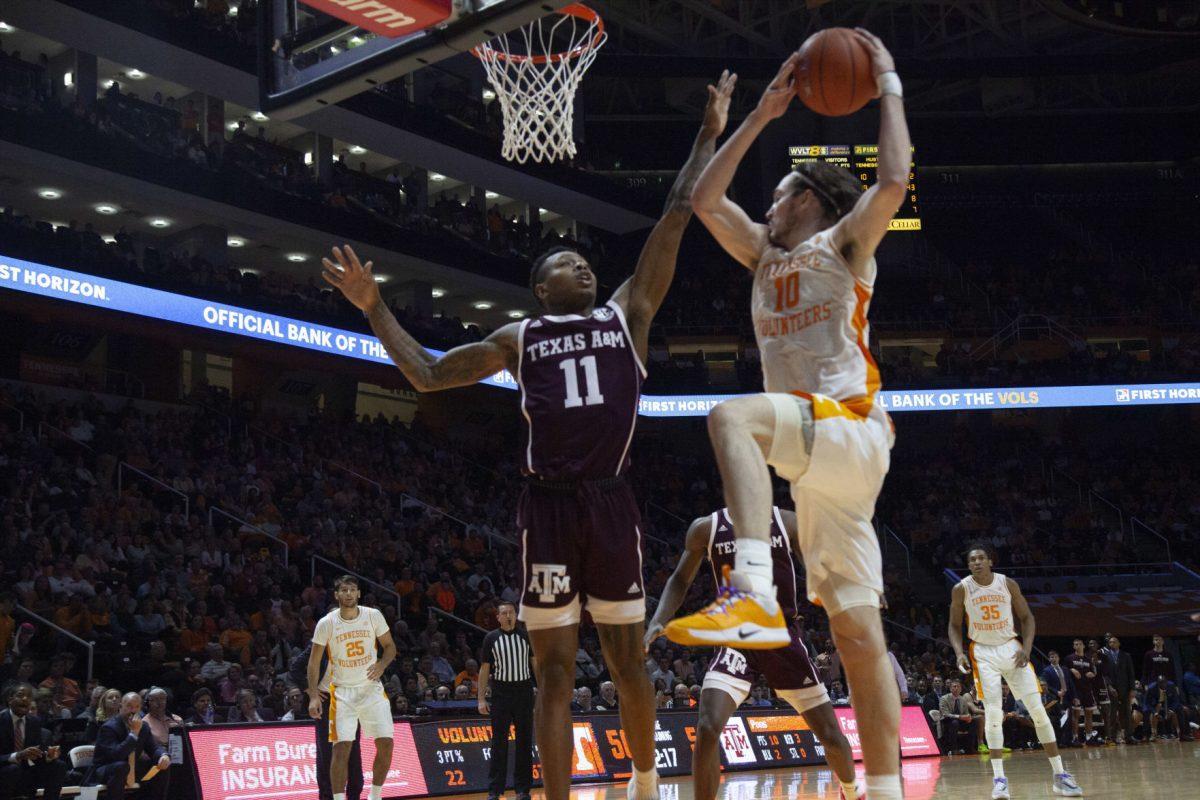 John Fulkerson, #10, brings the ball up and towards the hoop during the game against Texas A&amp;M on Tuesday, January 28, 2020 at Thompson-Boling Arena.