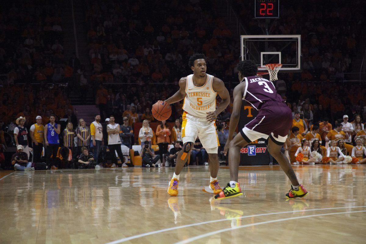 Josiah-Jordan James, #5, dribbles around a Texas A&amp;M player during the game on Tuesday, January 28, 2020 at Thompson-Boling Arena.