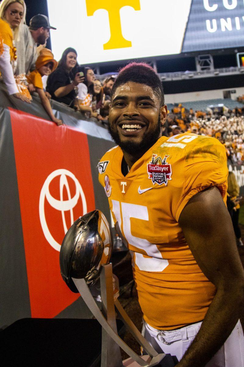 #15 Jauan Jennings showing off the trophy after the victory at the 2020 Tax Slayer Bowl game.