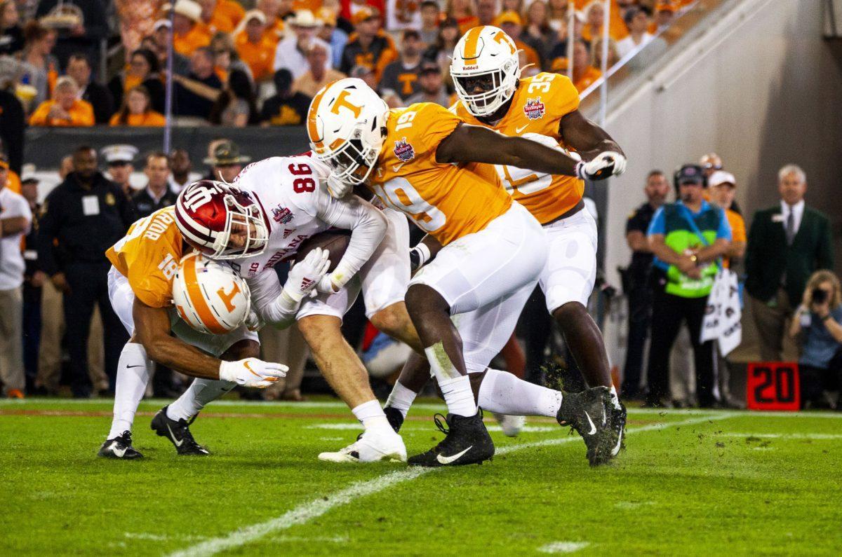 Swarm of Volunteers take down the Indiana receiver for a stop on 3rd down on Thursday, January 2, 2020 at the Tax Slayer Gator Bowl.