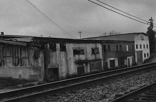 The backside of an old car dealership, garage, and tractor repair shop in New Tazewell.