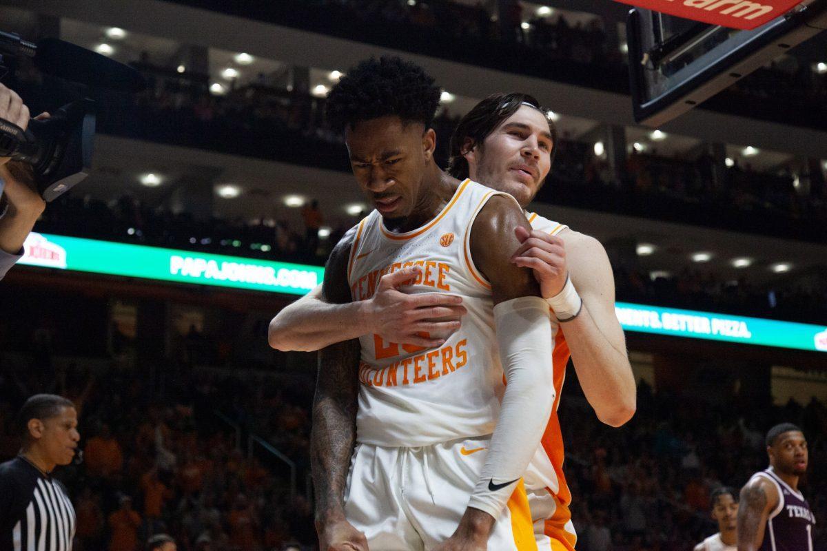 John Fulkerson, #10, hugs Jordan Bowden, #23, after Bowden dunked on Texas A&amp;M during the game on Tuesday, January 28, 2020 at Thompson-Boling Arena.