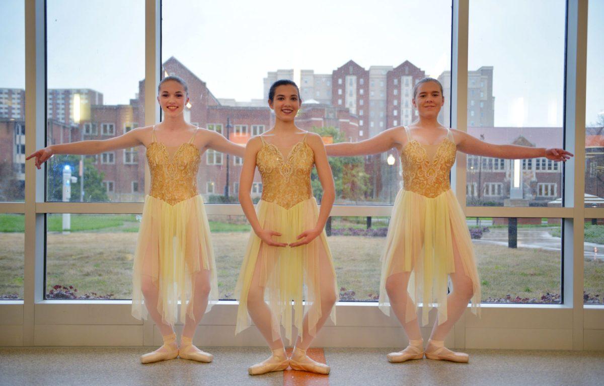 VOLS En Pointe members (left to right) Jess Simmons, Carinne Cheney and Rachel Harris pose in a plie during a photoshoot with the Daily Beacon on Tuesday, March 10, 2020 in the Student Union. 