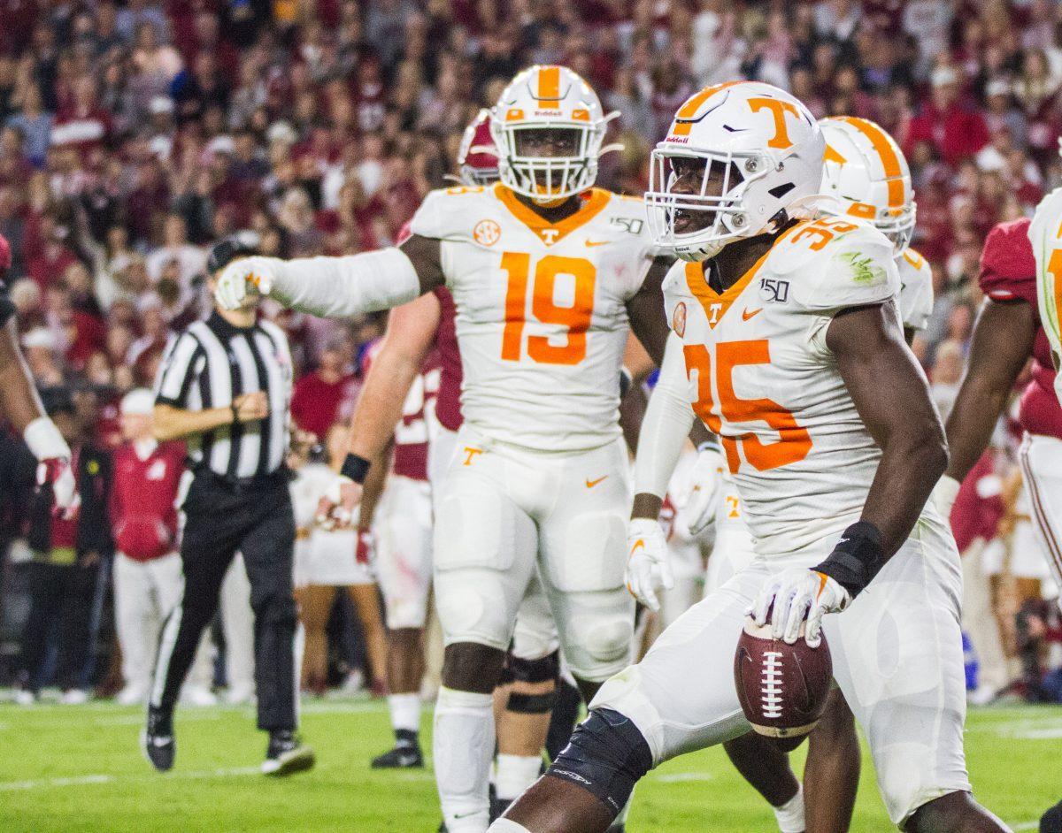 Darrell Taylor, #19, and Daniel Bituli, #35, prepare for a play during the Tennessee and Alabama football game at Bryant-Denny Stadium on Saturday, Oct.19, 2019. 