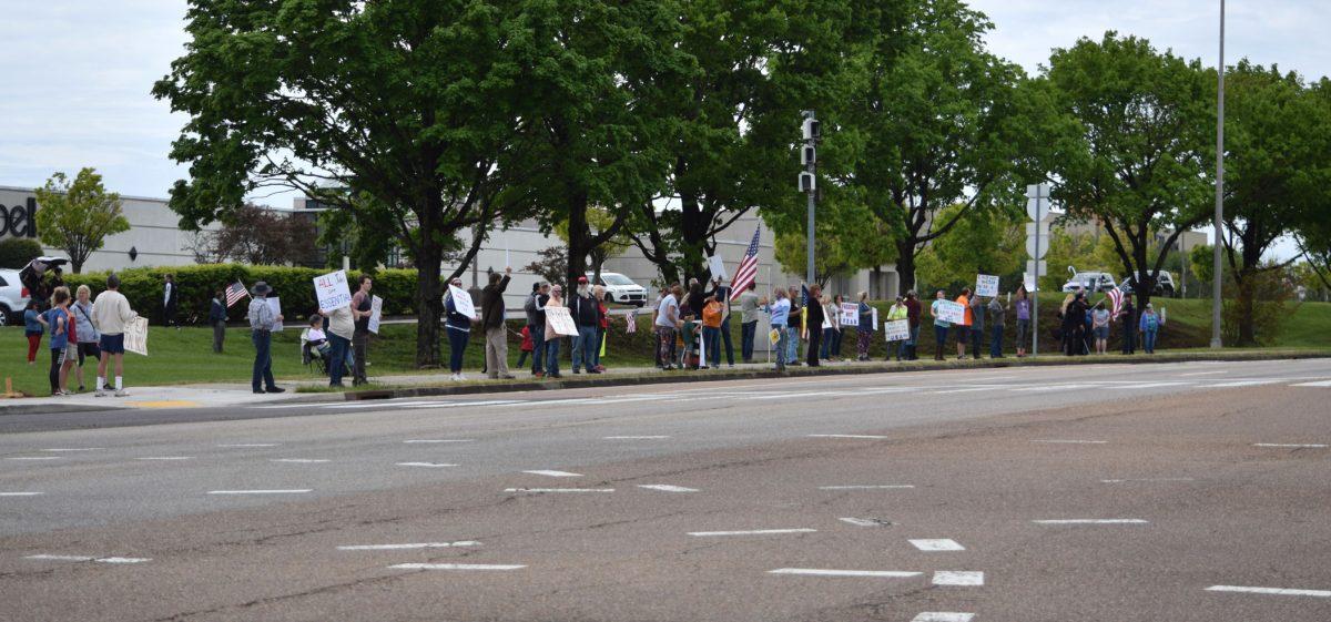 Protesters wave and hold signs along side Kingston Pike next to the closed West Town Mall during the Freedom Rally held on Sunday, April 19, 2020. The protest, one of seven across Tennessee, was to protest Governor Bill Lee’s stay-at-home orders and the closure of many local businesses.