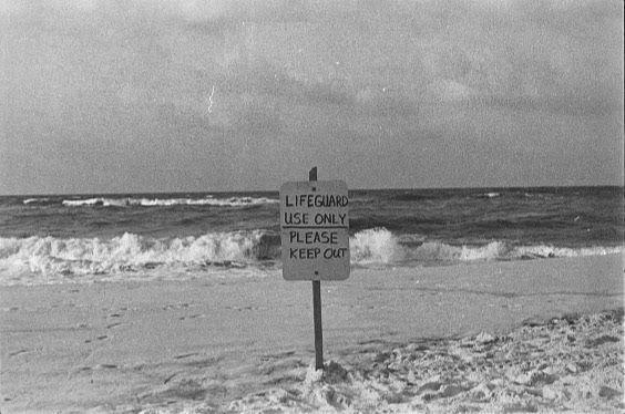 A sign on Navarre Beach, Florida, in 2019. With beaches and national parks across the country closed due to the coronavirus pandemic, only the bottom message applies today.