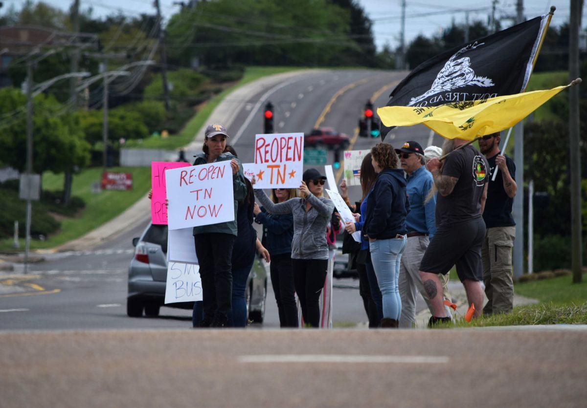 Protesters wave and hold signs at the corner of Morrell Road and Kingston Pike next to the closed West Town Mall during the Freedom Rally held on Sunday, April 19, 2020. The protest, one of seven across Tennessee, was to protest Governor Bill Lee’s stay-at-home orders and the closure of many local businesses.
