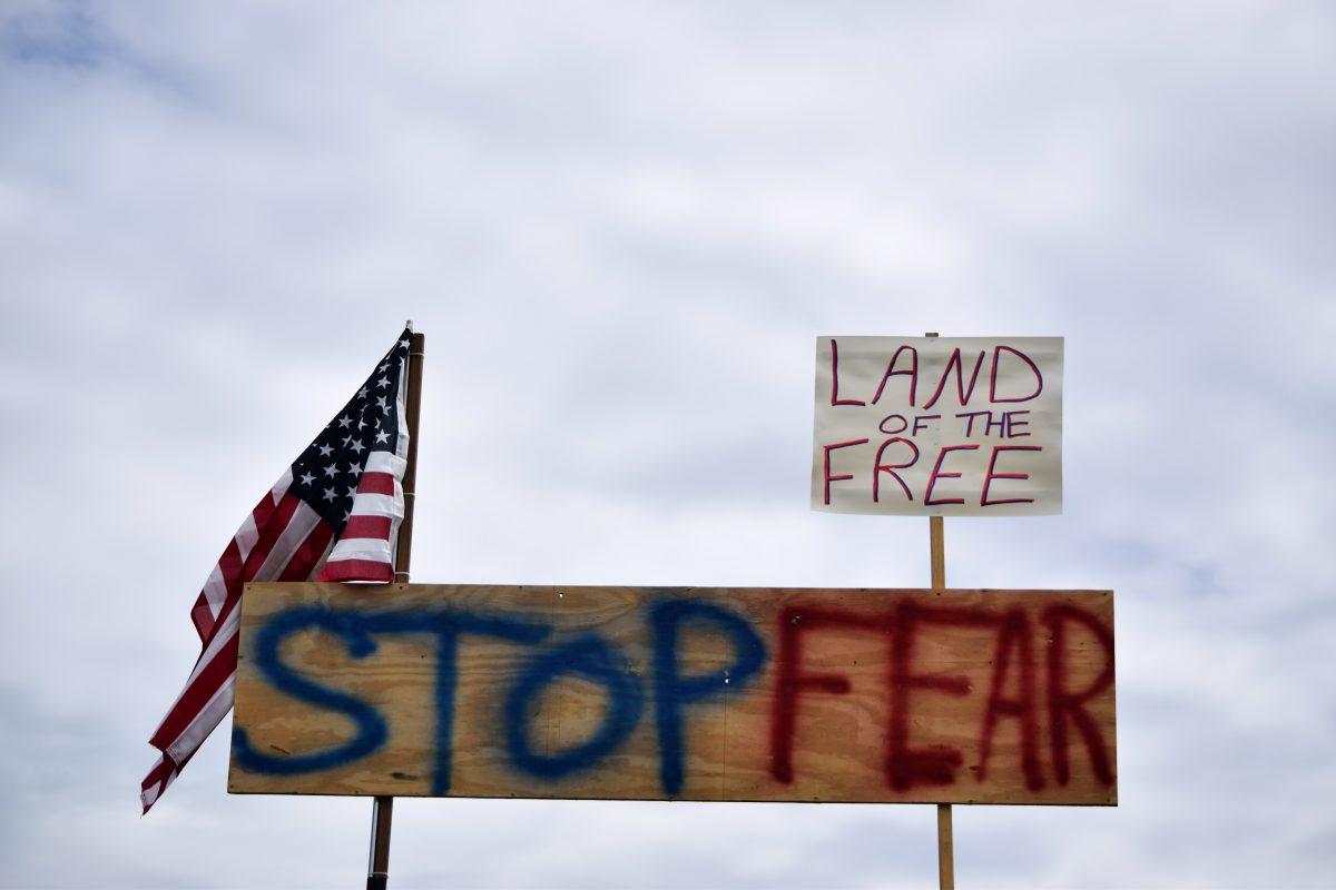 A sign attached to the top of a truck bed overlooked protesters during the Knoxville Freedom Rally on Sunday, April 19, 2020. Protesters came together in seven cities - Nashville, Memphis, Chattanooga, Jackson, Cookeville, Johnson City and Knoxville - to protest Governor Bill Lee's mandatory shutdown of nonessential businesses because of coronavirus concerns.