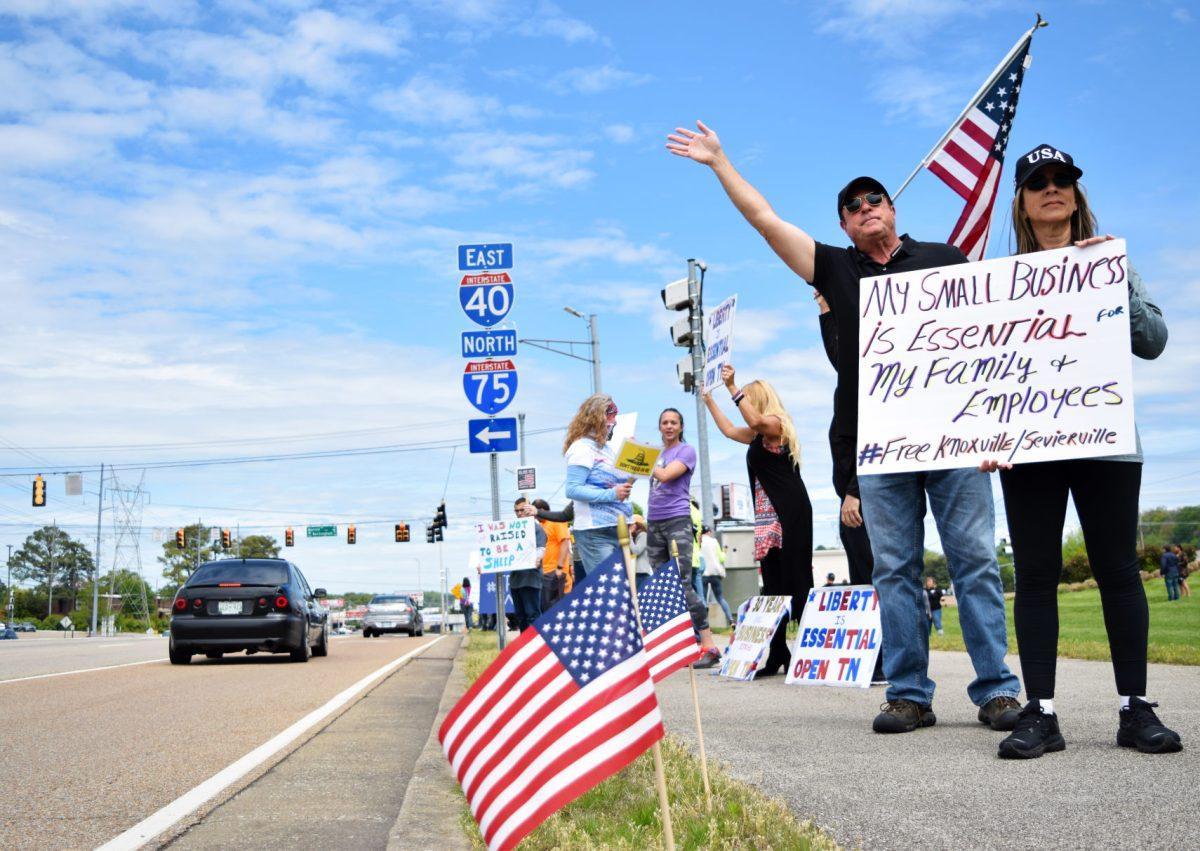 Protesters wave and hold signs along side Kingston Pike next to the closed West Town Mall during the Freedom Rally held on Sunday, April 19, 2020. The protest, one of seven held across Tennessee, was to protest Governor Bill Lee’s stay-at-home orders and the closure of many local businesses.