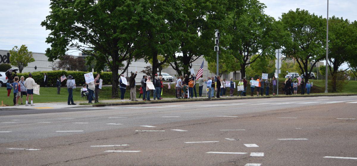 Protesters wave and hold signs along side Kingston Pike next to the closed West Town Mall during the Freedom Rally held on Sunday, April 19, 2020. The protest, one of seven across Tennessee, was to protest Governor Bill Lee’s stay-at-home orders and the closure of many local businesses.