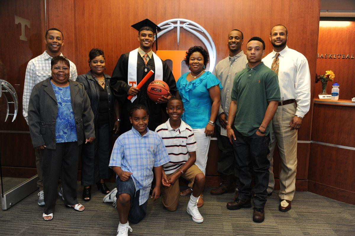 An older picture of the Bone family at Josh Bone's graduation in 2011. Jordan is pictured in a white striped polo, and Karen Bone is wearing a blue shirt.