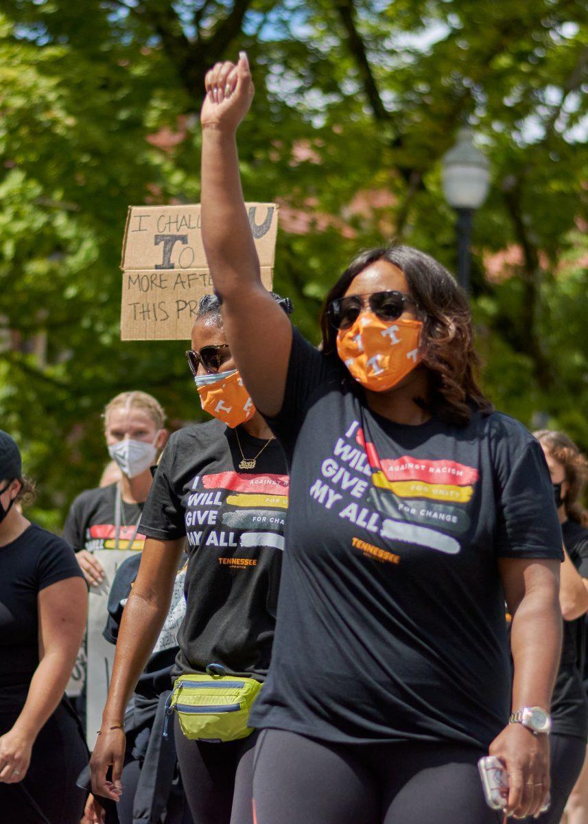 A supporter raises her fist in the final leg of the BLM March on August 29, 2020.