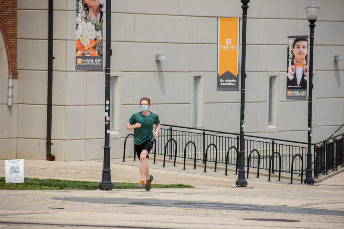 UT student running on campus while complying with the university's COVID-19 policies on Thursday, August 20, 2020.