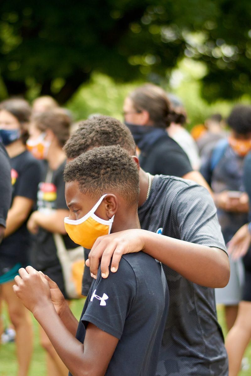 Two children embrace in Circle Park while waiting for the BLM March to begin, on August 29, 2020.