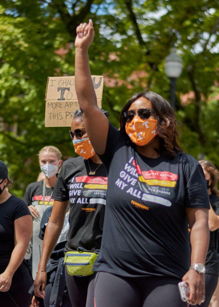A supporter raises her fist in the final leg of the BLM March on August 29, 2020.