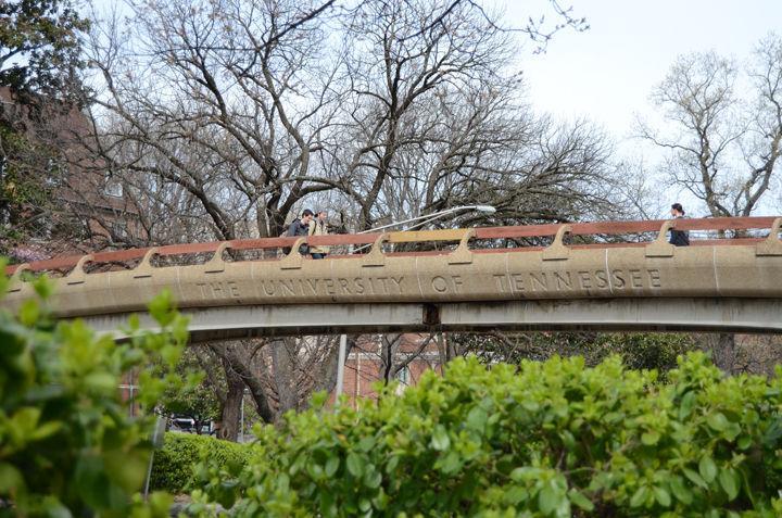 Students walk over one of UT's most recognizable landmarks on campus, the pedestrian bridge over Cumberland Avenue on Monday, March 7.