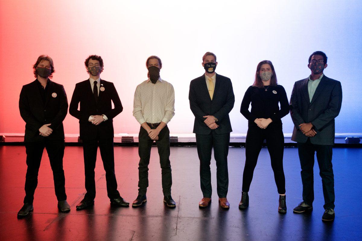 Student representatives pose after debate Monday night. Pictured from left to right: College Republicans Max Hawkins and Caesar Schanzenbach, College Libertarians Caleb Weaver and Austin Tallent and College Democrats Amanda Taylor and Jeevan Kypa