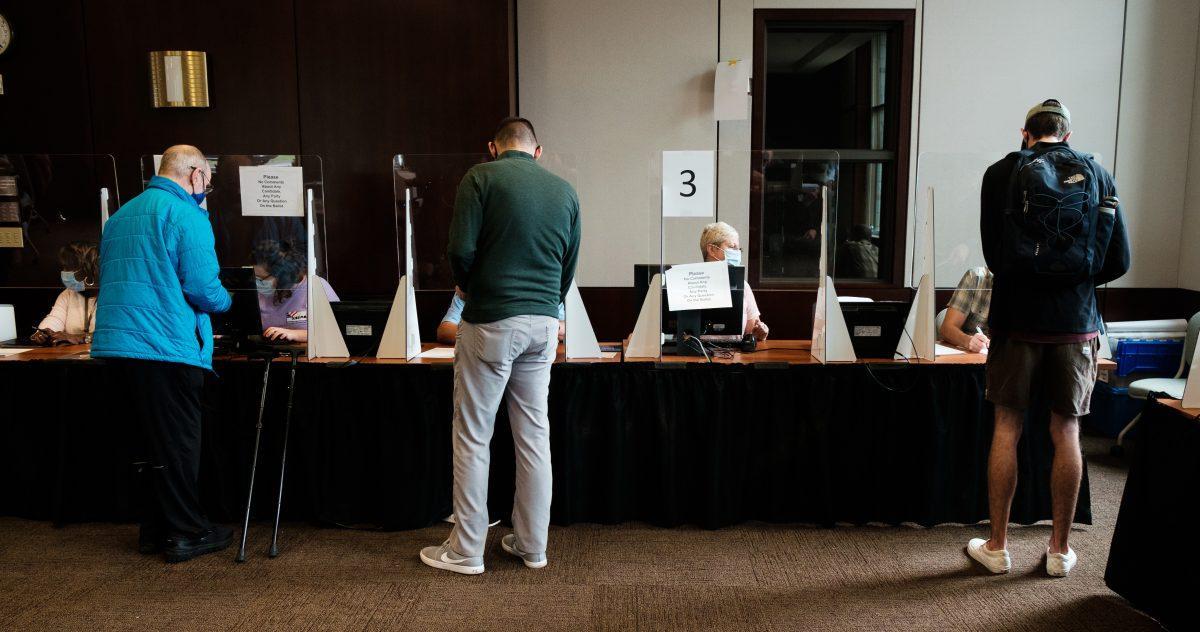 Voters have their registration forms checked at Howard Baker Jr. Center on Oct. 26, 2020.