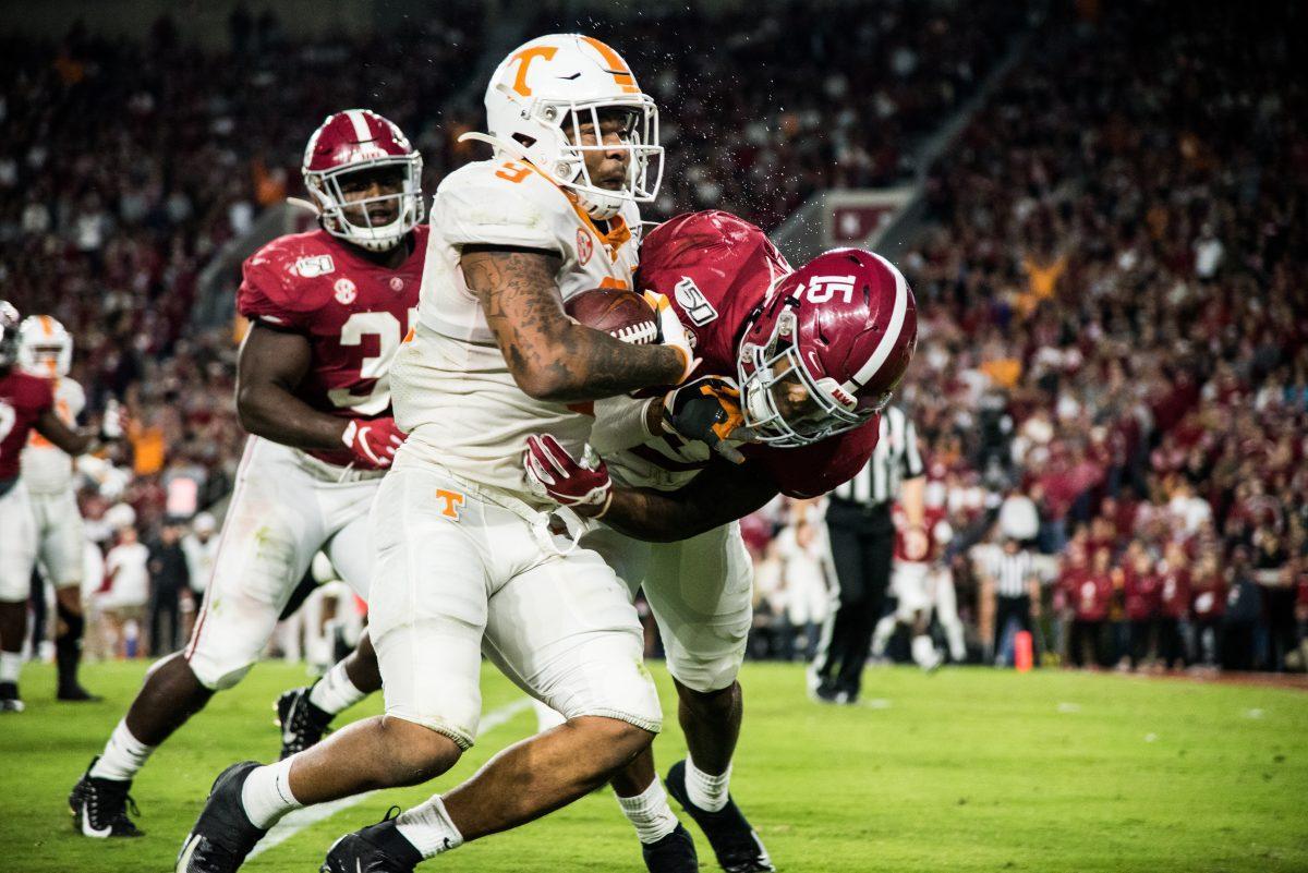 Tennessee running back Tim Jordan, #9, sprints down the field as Alabama defensive back Xavier McKinney, #15, attempts to tackle him at Bryant-Denny Stadium on Saturday, Oct.19, 2019.