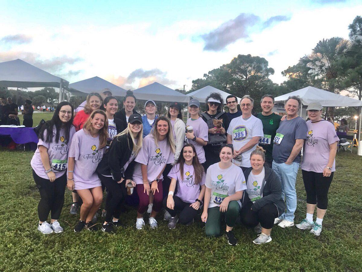 Lindsey (bottom row, fourth from left) with others fundraising for Team Kim.