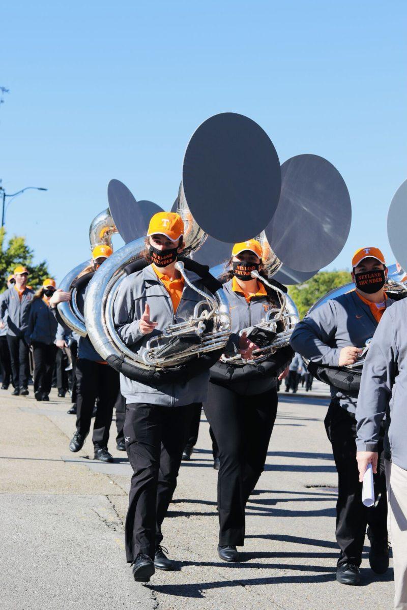 The UT band marching down Peyton Manning Pass towards Neyland Stadium for the first football home game vs. Missouri on Oct. 3, 2020.