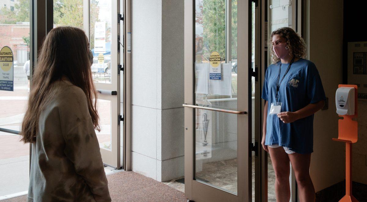 Poll workers enjoy a chat during downtime at Howard Baker Jr. Center on Oct. 26, 2020.