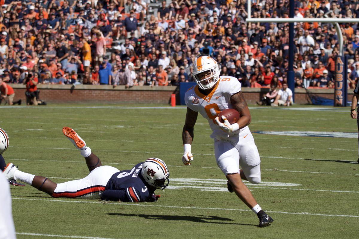 Tim Jordan, #9, runs the ball against Auburn on Oct. 13, 2018 at Jordan-Hare Stadium.