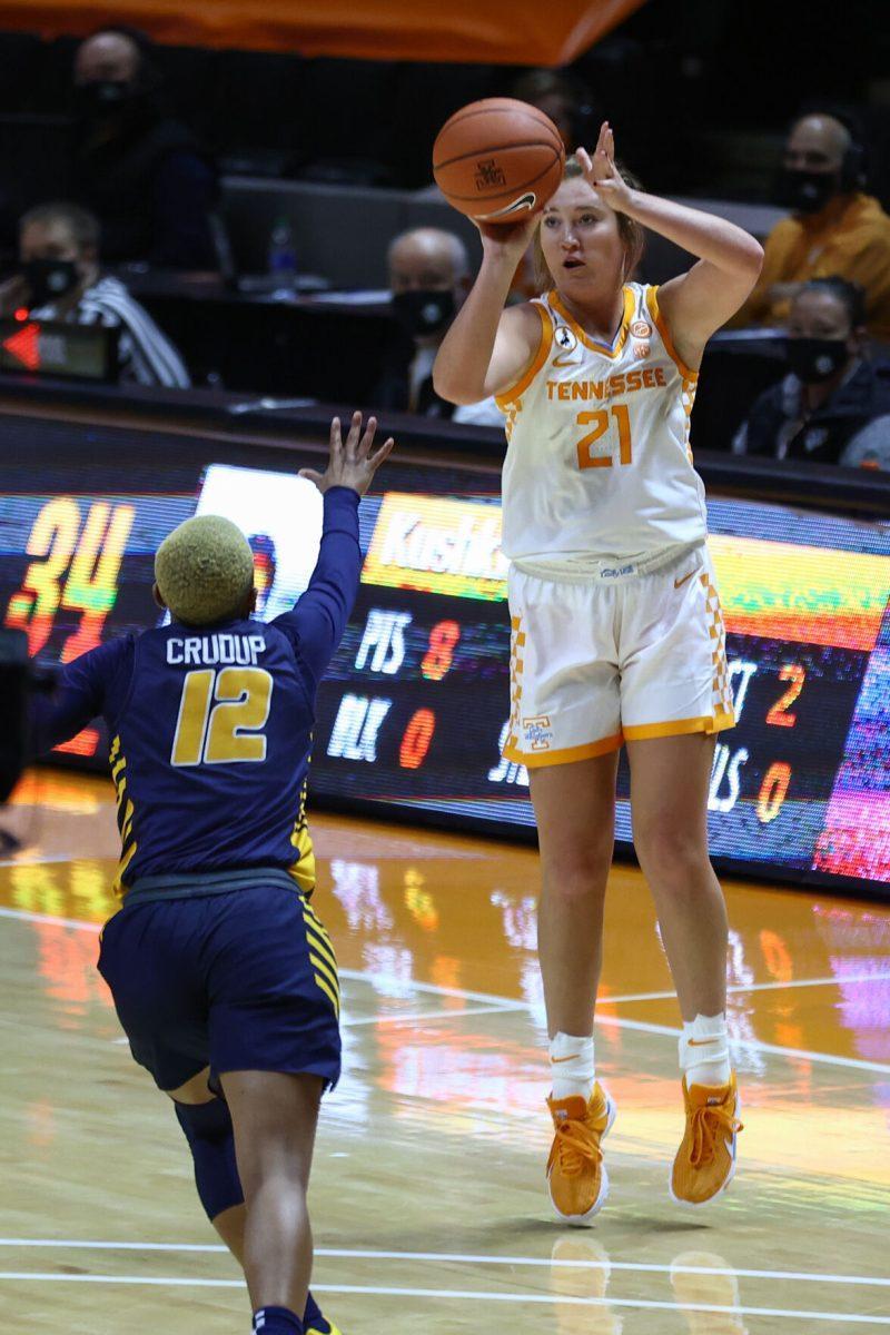 Dec 20, 2020; Knoxville, Tennessee, USA; Tennessee Lady Vols guard Tess Darby (21) shoots the ball against UNC Greensboro Spartans guard CeCe Crudup (12) during the second half at Thompson-Boling Arena. Mandatory Credit: Randy Sartin-USA TODAY Sports