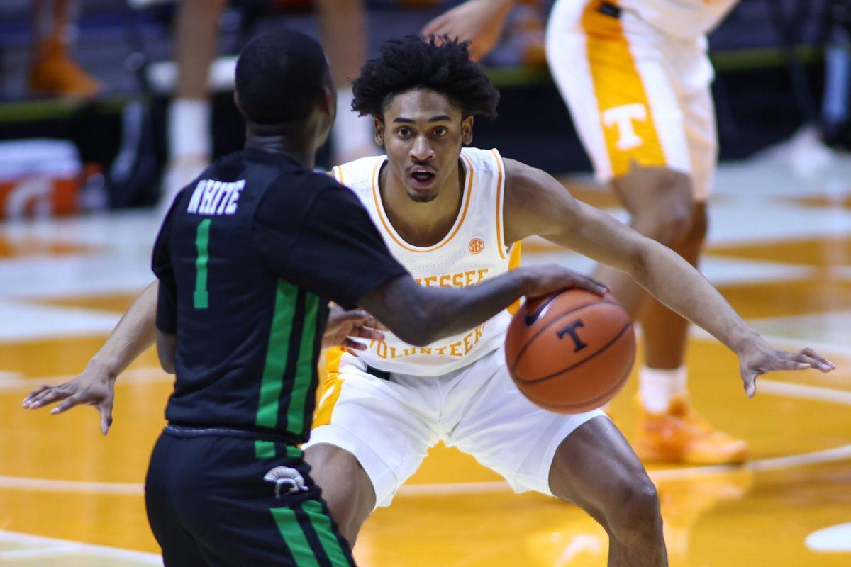 Dec 23, 2020; Knoxville, Tennessee, USA; USC Upstate Spartans guard Dalvin White (1) moves the ball against Tennessee Volunteers guard Keon Johnson (45) during the first half at Thompson-Boling Arena. Mandatory Credit: Randy Sartin-USA TODAY Sports
