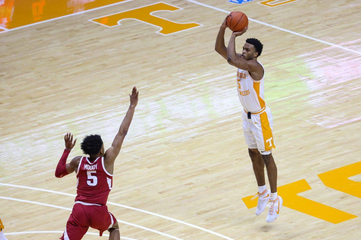 Jan 6, 2021; Knoxville, Tennessee, USA; Tennessee Volunteers guard Josiah-Jordan James (5) shoots the ball against Arkansas Razorbacks guard Moses Moody (5) during the first half at Thompson-Boling Arena. Mandatory Credit: Randy Sartin-USA TODAY Sports