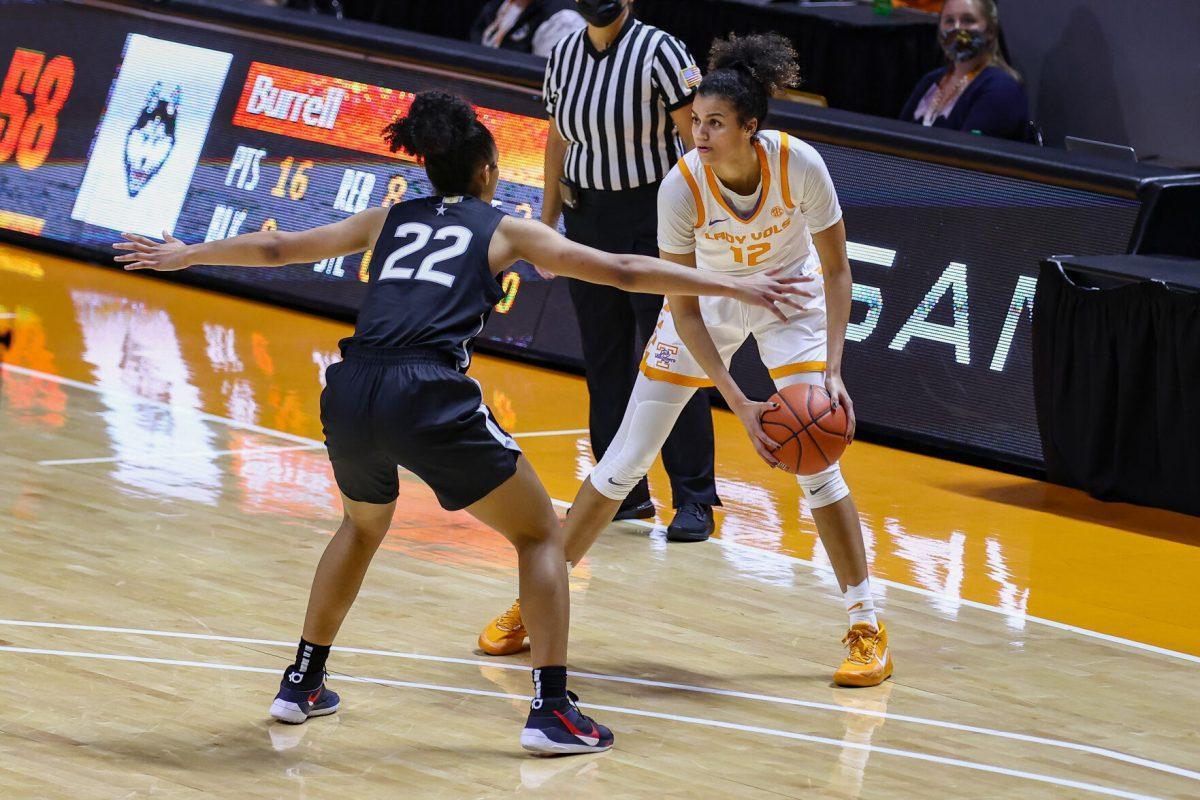 Jan 21, 2021; Knoxville, Tennessee, USA; Tennessee Lady Vols guard Rae Burrell (12) looks to move the ball against UConn Huskies guard Evina Westbrook (22) during the second half at Thompson-Boling Arena. Mandatory Credit: Randy Sartin-USA TODAY Sports