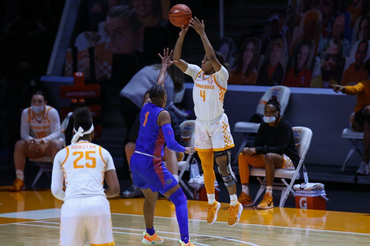 Jan 31, 2021; Knoxville, Tennessee, USA; Tennessee Lady Vols guard Jordan Walker (4) shoots a three pointer against Florida Gators guard Kiara Smith (1) during the second half at Thompson-Boling Arena. Mandatory Credit: Randy Sartin-USA TODAY Sports