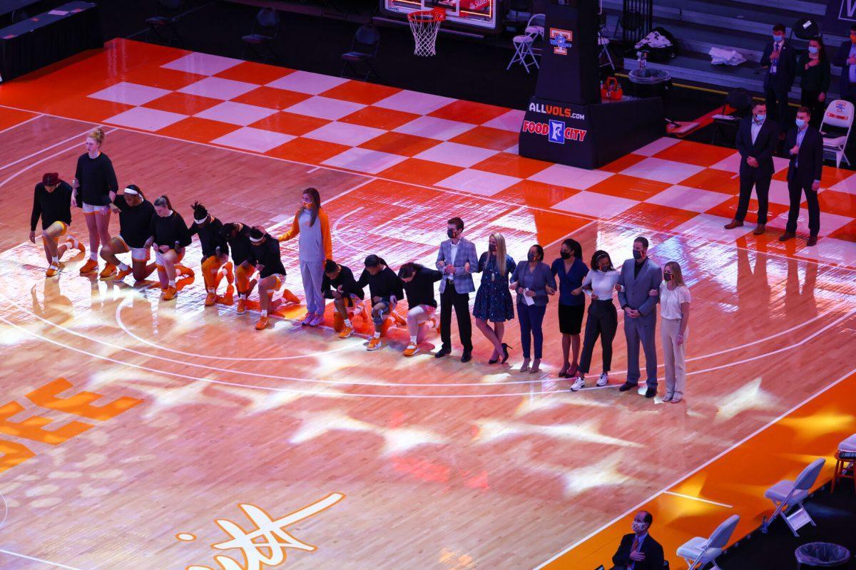 Jan 7, 2021; Knoxville, Tennessee, USA; The Tennessee Lady Vols kneel during the national anthem before the game against Arkansas Razorbacks at Thompson-Boling Arena. Mandatory Credit: Randy Sartin-USA TODAY Sports
