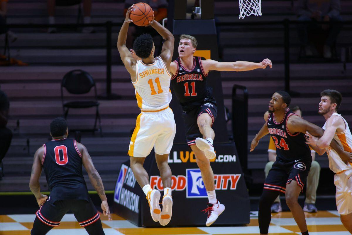 Feb 10, 2021; Knoxville, Tennessee, USA; Tennessee Volunteers guard Jaden Springer (11) shoots the ball against Georgia Bulldogs guard Jaxon Etter (11) during the first half at Thompson-Boling Arena. Mandatory Credit: Randy Sartin-USA TODAY Sports