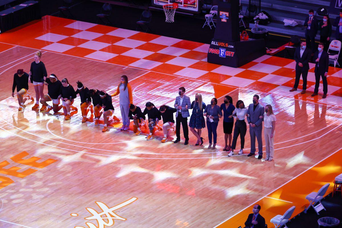 Jan 7, 2021; Knoxville, Tennessee, USA; The Tennessee Lady Vols kneel during the national anthem before the game against Arkansas Razorbacks at Thompson-Boling Arena. Mandatory Credit: Randy Sartin-USA TODAY Sports